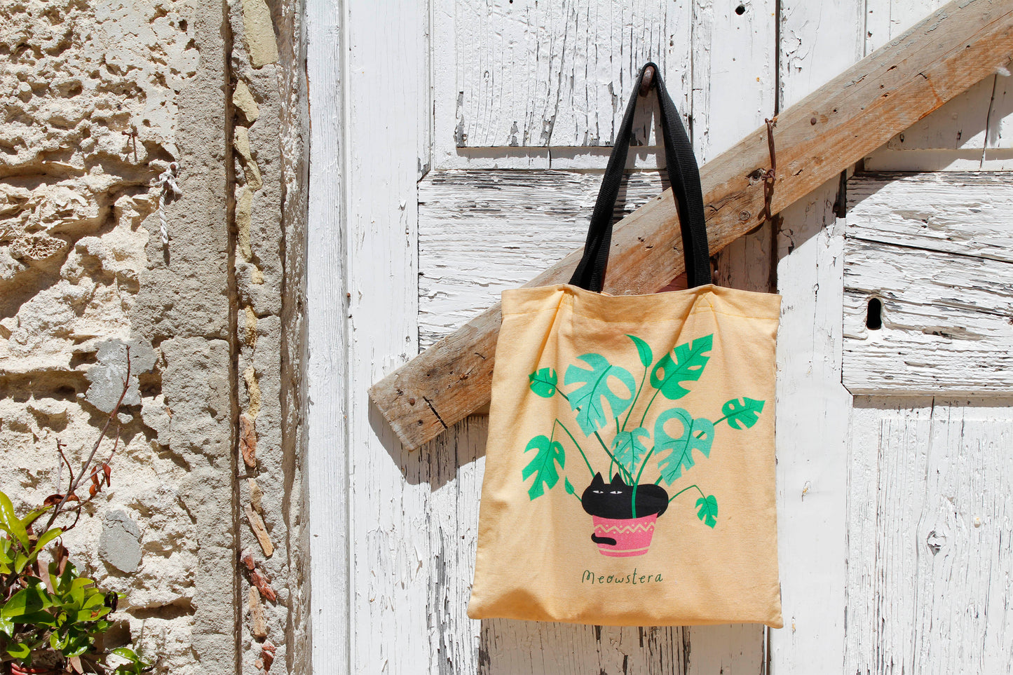 Printed Cotton Canvas Tote Bag - Meowstera, a Chubby Black Cat Sitting on a Monstera Plant