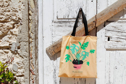 Printed Cotton Canvas Tote Bag - Meowstera, a Chubby Black Cat Sitting on a Monstera Plant